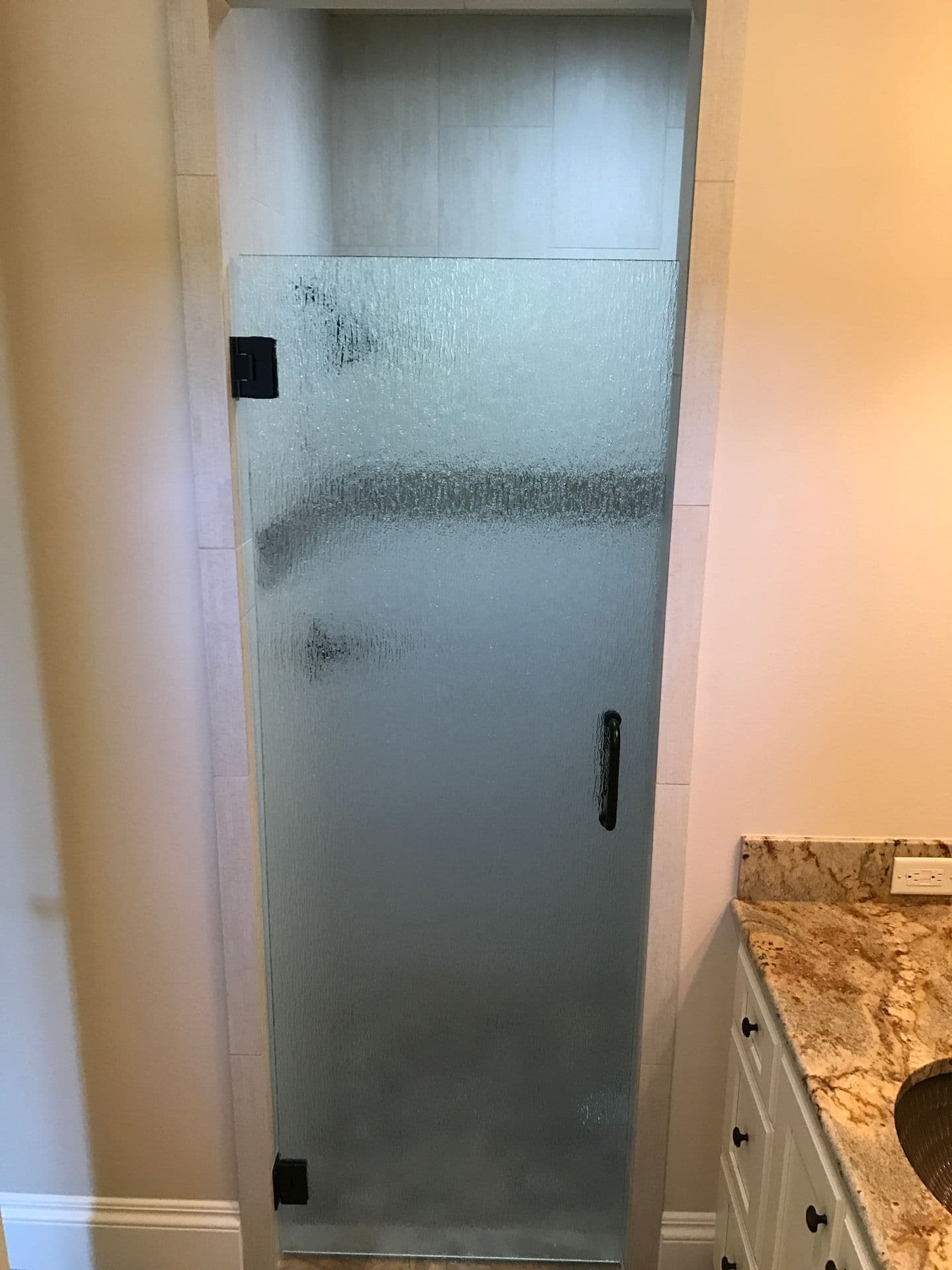 Frameless shower enclosure installation